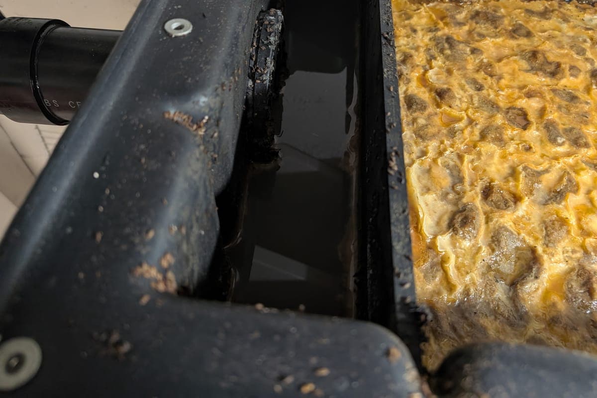 Heavy grease and scum layer in a tank due for service