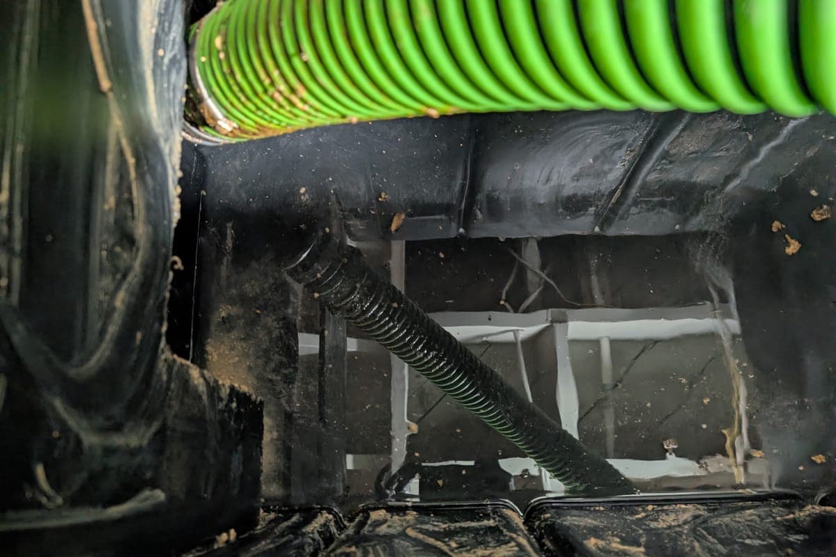 Interior of a septic tank showing the baffle wall between compartments